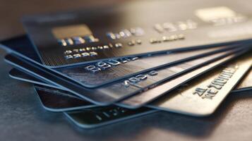 The collection of modern credit cards arranged on a wooden surface. photo