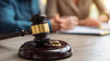 The gavel symbolizes a crucial moment in divorce proceedings and legal agreements. photo