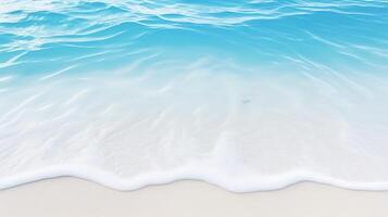 A blue ocean with white waves and sand photo