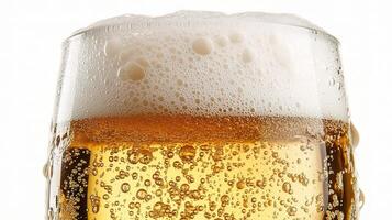 A glass of beer with bubbles on a white background photo