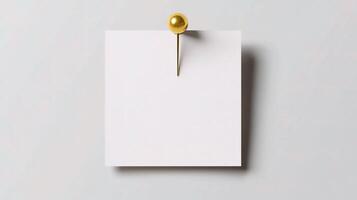 A white paper with a gold pin on it photo