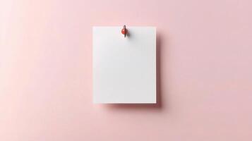 Blank note on pink background with pushpin photo