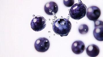 Blueberries are being splashed with water photo