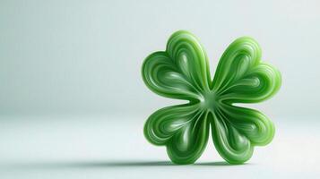 A green four leaf clover on a white background photo