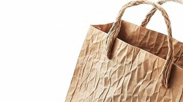 A brown paper bag with rope handles photo