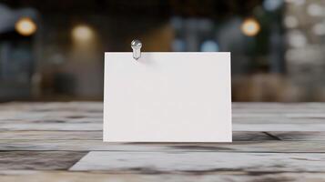 Blank note paper on a table with a pin photo