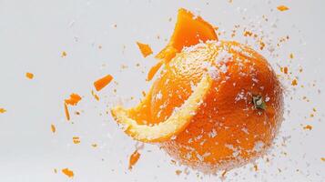 A half orange is being splashed with water photo