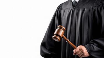 A judge holding a gavel and wearing a black robe photo