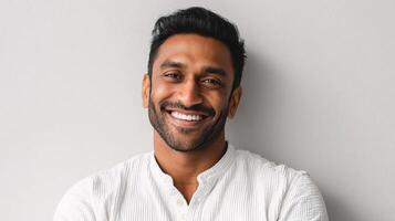 A smiling man in a white shirt photo