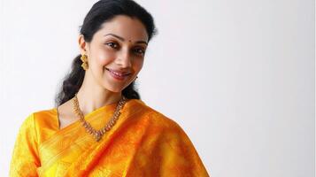 A woman in an orange sari smiling photo