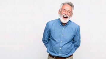 A man with a beard and a blue shirt is laughing photo