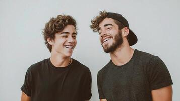 Two young men smiling and laughing together photo