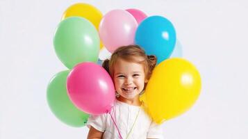A little girl holding a bunch of balloons photo