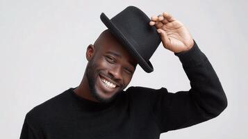A man is smiling while wearing a hat photo