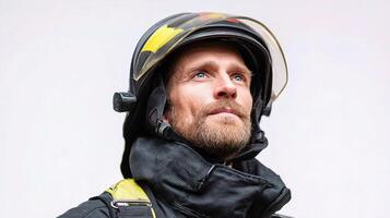 A man in a fireman's helmet looking up photo