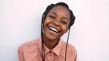 A young girl with braids is smiling photo