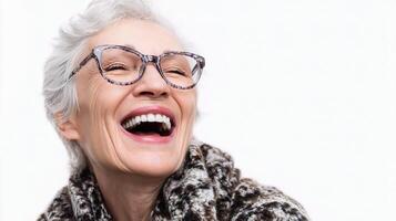 A woman with glasses and a scarf laughing photo