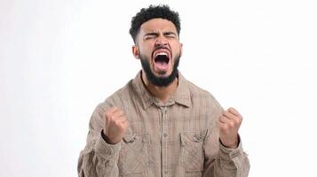 A man with a beard and shirt is yelling photo