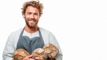 A smiling man holding bread in his hands photo