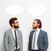 Two men in suits talking with speech bubbles photo