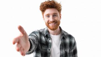 A man with red hair and a plaid shirt is smiling photo