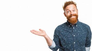 A man with a beard and a blue shirt is holding something photo