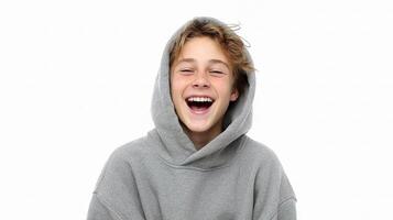 A boy wearing a hoodie and laughing photo