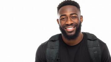 A black man with a beard and backpack smiling photo