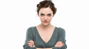 A woman with her arms crossed and a serious look on her face photo