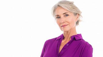A woman with gray hair and a purple shirt photo