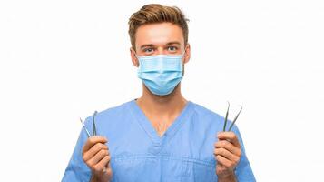 A man in scrub clothes holding scissors and a mask photo