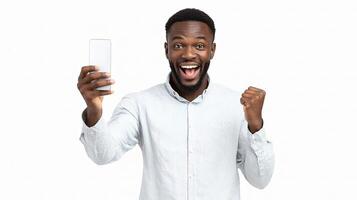 A man holding up a cell phone and making a fist photo