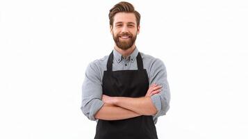 A man with a beard and apron standing with his arms crossed photo