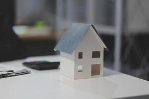 A model house sits on a table photo