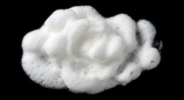 A close up of a white foam on a black background photo