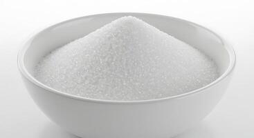 White sugar in a bowl on a white background photo