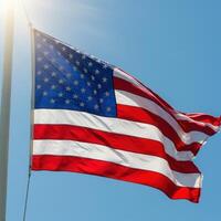 An american flag blowing in the wind photo
