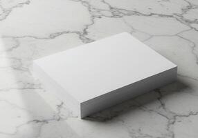 Blank white paper on marble surface photo
