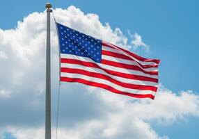 An american flag is flying in the wind photo