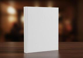Blank book on wooden table with blurred background photo