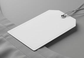 Blank white tag on a grey background photo