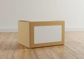A cardboard box sitting on a wooden floor photo