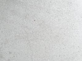 Modern light grey limestone texture background in white light polished empty wall paper. luxury gray concrete stone table top desk view concept grunge seamless marble. photo