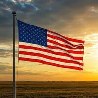 An american flag is flying in the wind at sunset photo