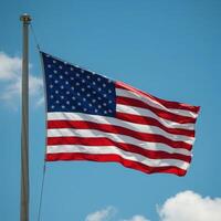 An american flag flying in the wind photo