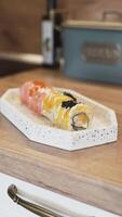 Home Chef Finishing Sushi Plate with a Touch of Pickled Ginger for a Simple Yet Elegant Presentation video