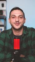 Content Creator Recording Podcast Episode for TikTok Using Vertical Camera and Microphone in Home Studio video