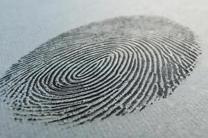 Macro close up of a fingerprint detail on a textured surface photo