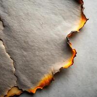 Burnt paper edges create an aged and textured background effect photo