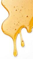 Golden Honey Drips, A Close-Up of Viscous Sweetness on White Surface photo